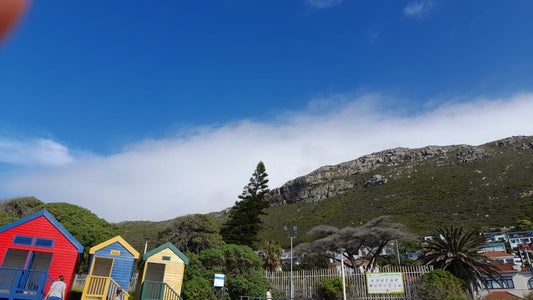 Mountains by Muizenberg with light clouds above